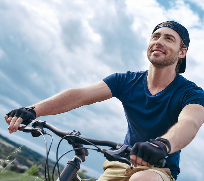 Men Smiling while Biking before LASIK at Standard Optical