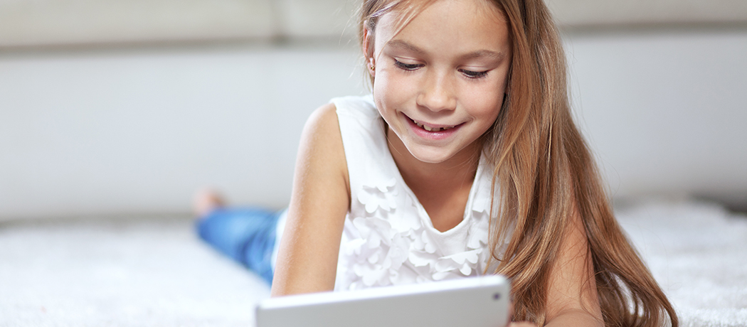 Kid is happy using tablet at Standard Optical