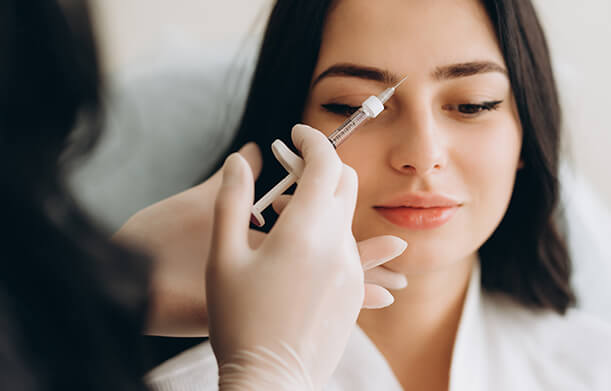 woman go through botox treatment at Standard Optical