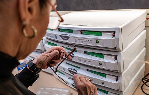 standard optical employee fixing eyeglasses frames