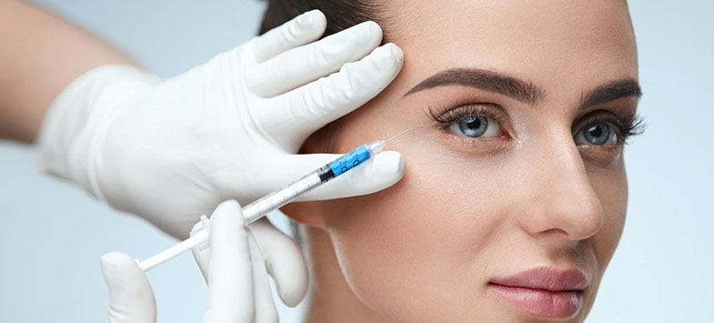 A woman receiving botox injections.